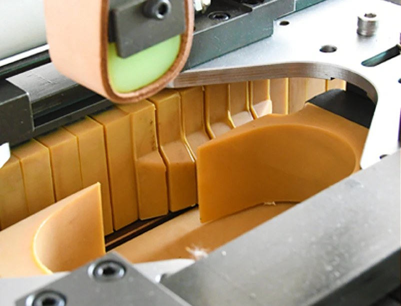 sole attaching machine pressing the outsole to the upper